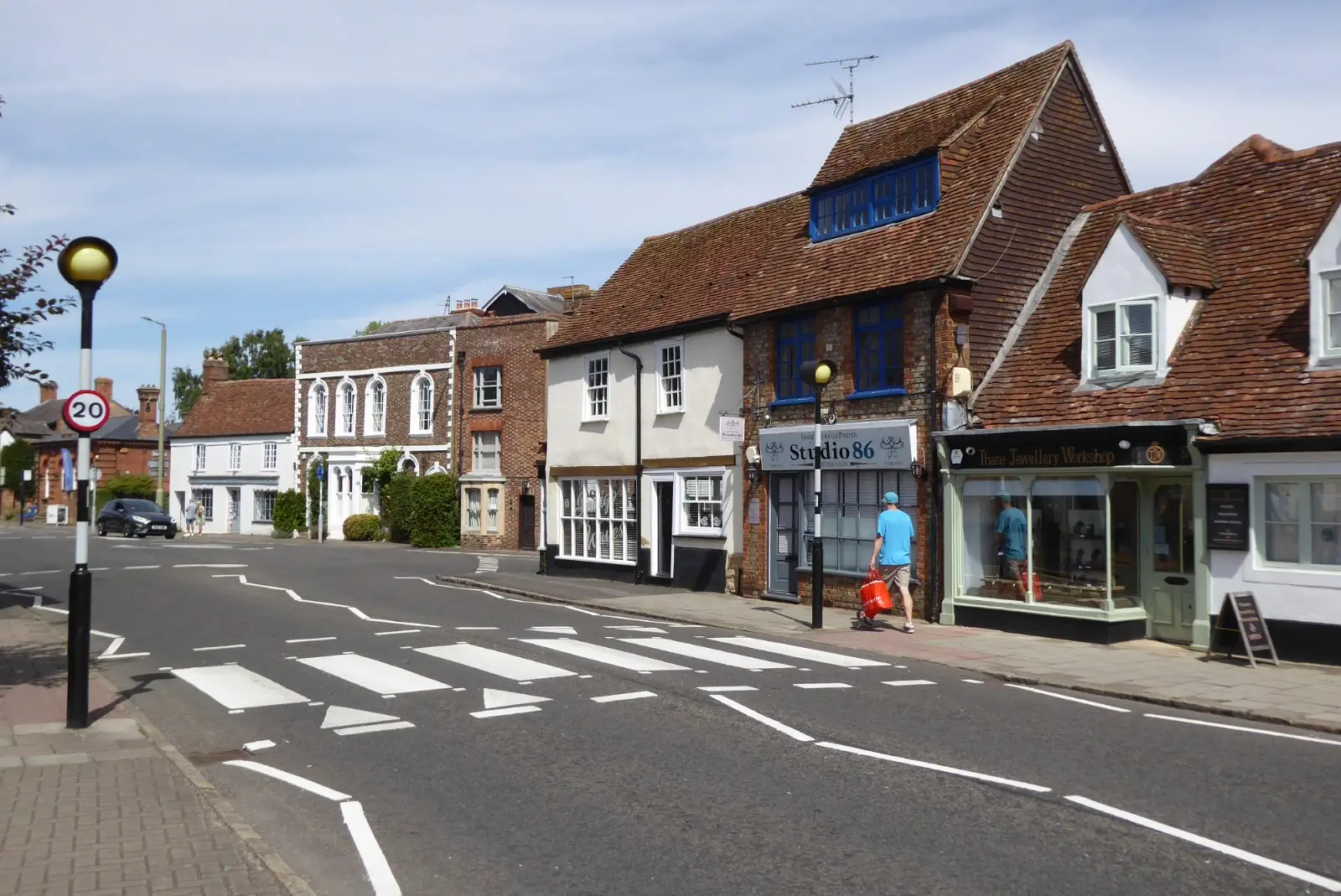 High Street in Thame, Oxfordshire, with historic buildings lining the wide market street
